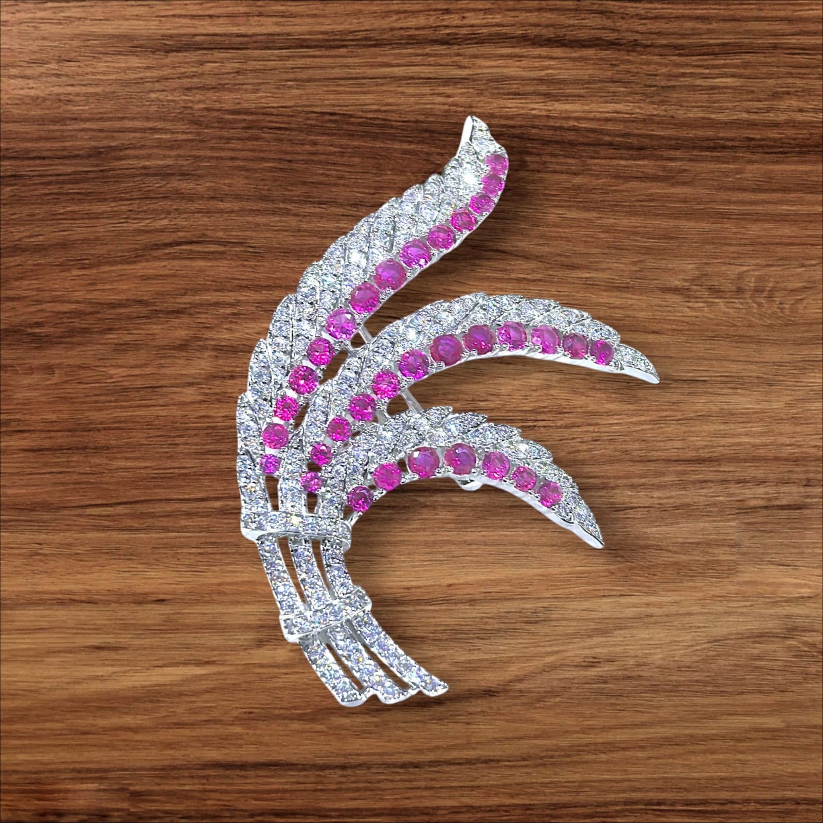 The Phoenix Wing 925 silver Brooch studded with red and white CZ stone